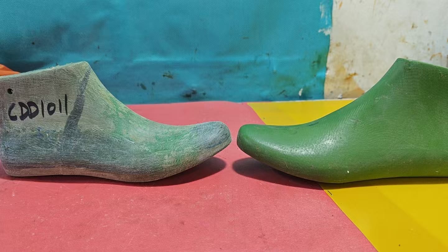 Shoe lasts compared side by side during fit development