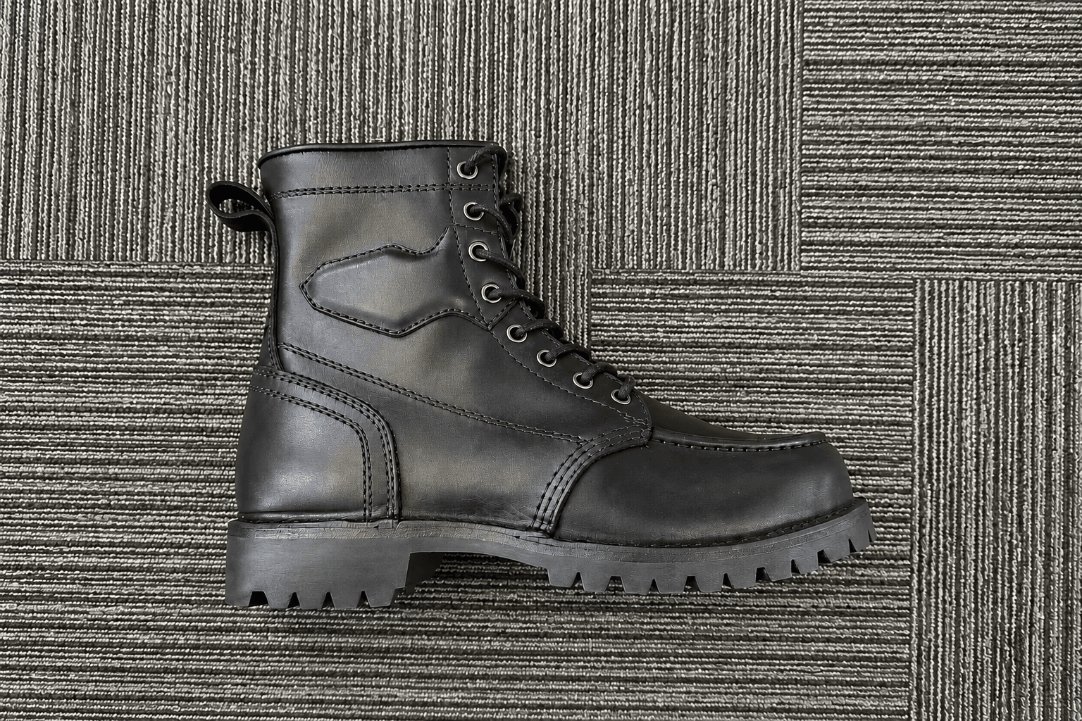 Boot construction detail showing stitching, welt and lug outsole